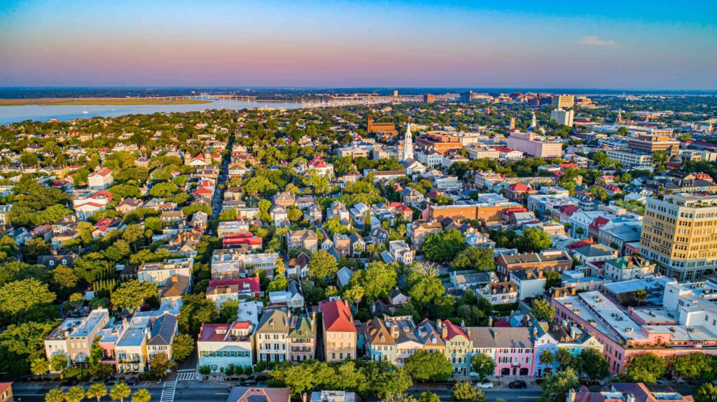 Aerial view of Charleston, South Carolina including Rainbow Row. Beautiful pastel homes line the area.