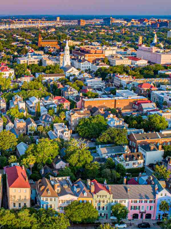 Aerial view of Charleston, South Carolina including Rainbow Row. Beautiful pastel homes line the area.